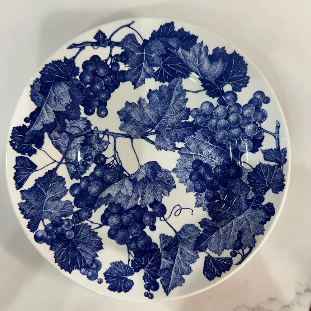 Four Crate and Barrel and Windsor Blue and White Grapevine place settings
